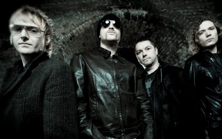 Men sunglasses brick wall group - bauhaus free wallpaper