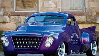 Purple car parked building window 2 - a purple car free wallpaper for desktop