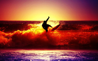 Surfer riding wave ocean sunset 5 - in the ocean free wallpaper