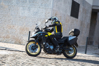 Man motorcycle cobblestone road building - viennese actionism free wallpaper