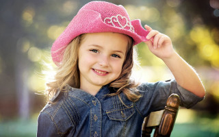 Little girl pink hat smiling 3 - a pink hat free wallpaper