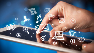 Person tablet icons touching screen - free technology wallpaper