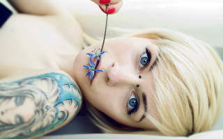 Woman flower nose tattoo arm - a flower free wallpaper for desktop