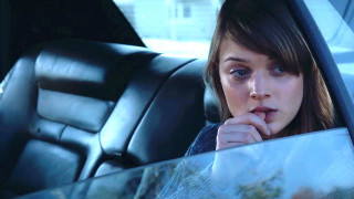 Woman sitting car looking out - a car free wallpaper