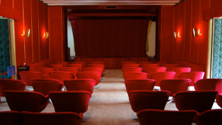 Red chairs curtained area center - area free wallpaper
