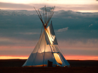 Teepee sunset field clouds sky - a sunset in the background free wallpaper for desktop