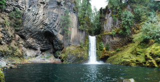Waterfall river background man standing - the middle of a river free wallpaper