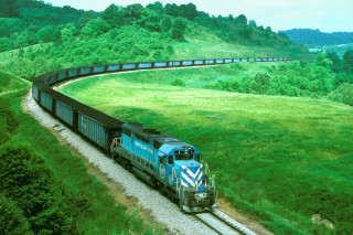 Train traveling countryside green field - a grassy hill free wallpaper