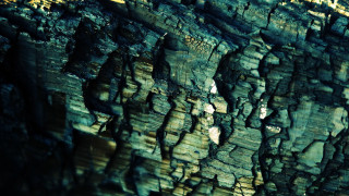 Close up rock formation sky - a small amount of light free wallpaper