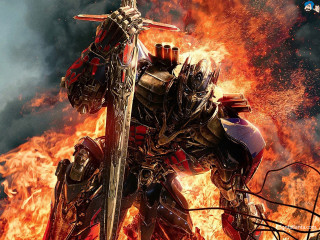 Robot fire sword standing in - his hand and a sword free wallpaper for desktop