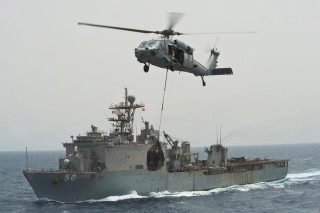 Helicopter lifting ship water shore - a helicopter free wallpaper