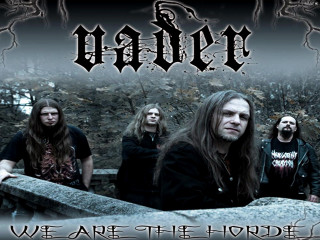 Group men standing stone wall - daren bader free wallpaper