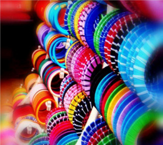Colorful frisbees stacked row table - hurufiyya free wallpaper for tablet