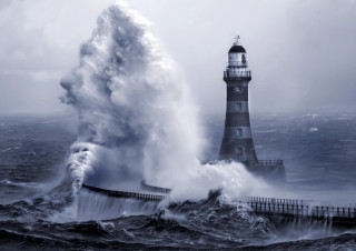 Lighthouse wave crashing ocean background - a lighthouse in the background free wallpaper