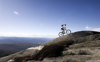 Man biking rocky hill valley - a bike free wallpaper for desktop