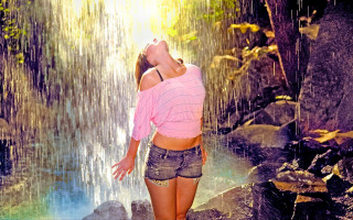 Woman waterfall pinkshirt denim shorts - a waterfall free wallpaper