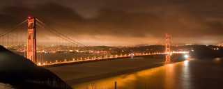 Night bridge city lights dark - a dark sky in the background free wallpaper
