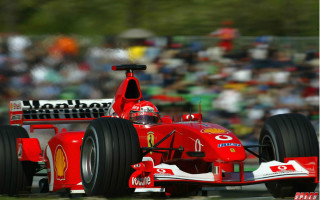 Red race car motion blur - a red race car free wallpaper