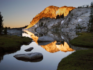 Mountain lake rock formation reflection - a reflection of the mountain free wallpaper