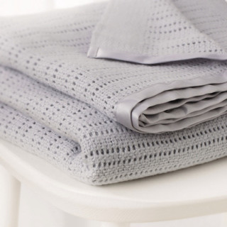 Stack folded blankets white table - a white table next free wallpaper