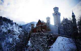 Castle tower clock snow mountainside - neo free wallpaper for desktop