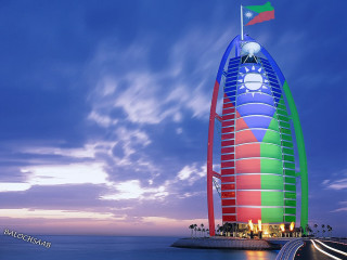 Tall building flag ocean dusk - a long exposure of light free wallpaper