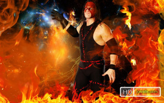 Man wrestling suit fire background - his hands out free wallpaper