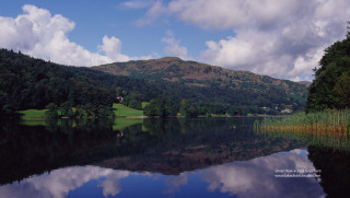 Lake mountain clouds grassy reflections - a grassy area in the foreground free wallpaper