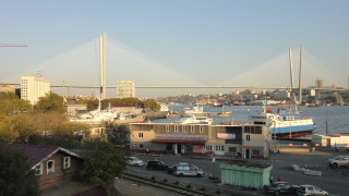Bridge river cars parking buildings - over a river free wallpaper