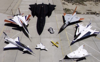 Fighter jets tarmac parking lot - a group of fighter jets free wallpaper