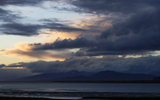 Mountains lake beach sunset cloudy - the background and a person free wallpaper