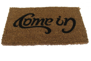 Welcome mat come in black - a woodcut free wallpaper