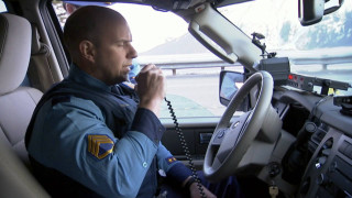 Police officer driving phone conversation - a police officer free wallpaper