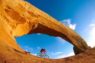 Man bike desert rock arch 8 - a bike free wallpaper for desktop