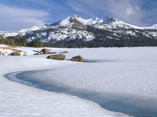 Snow covered mountain range stream - a small stream free wallpaper