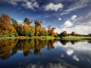 Lake trees clouds bench foreground 2 - a bench in the foreground free wallpaper