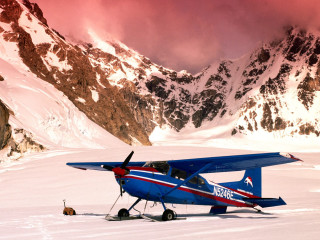 Blue airplane snow field mountains - field next free wallpaper