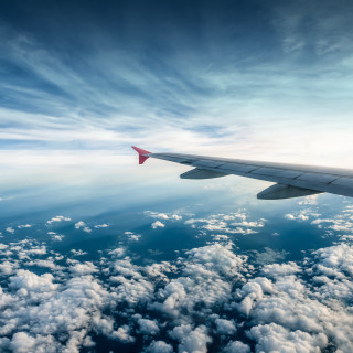 Plane wing clouds ocean blue - free airplane wallpaper for tablet