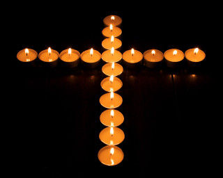 Candles cross table black background - orphism free wallpaper