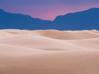 Desert mountain range pink sky - a mountain range in the distance free wallpaper