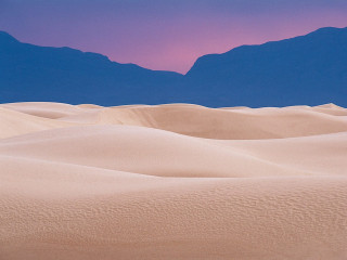 Desert mountain range pink sky 6 - a pink sky in the background free wallpaper