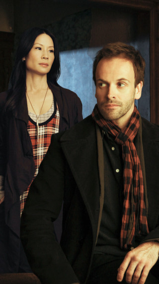 Man woman sitting room blue - international free wallpaper