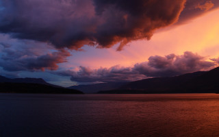 Large body water cloudy sky 2 - a large body of water under a cloudy sky free wallpaper