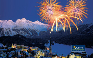 Fireworks town mountains blue sky - a firework free wallpaper
