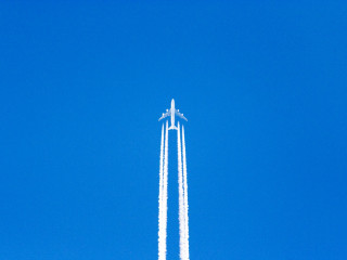 Jet flying blue sky contrails - free airplane wallpaper