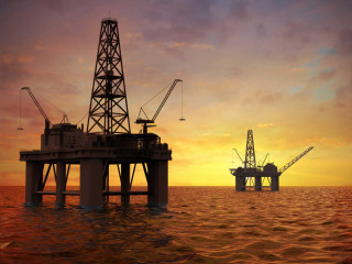 Oil rig crane ocean sunset - orange free wallpaper