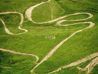 Green field white sign mountain - bernard fleetwoodwalker free wallpaper for desktop