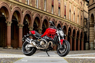 Red motorcycle parked building street - a street corner free wallpaper