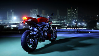 Red motorcycle roof night city - a red motorcycle free wallpaper