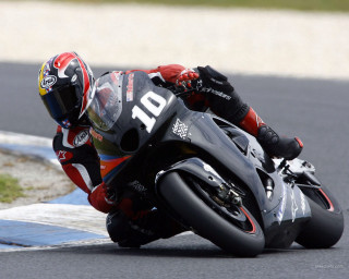 Motorcycle curve leaning helmet track - a person free wallpaper